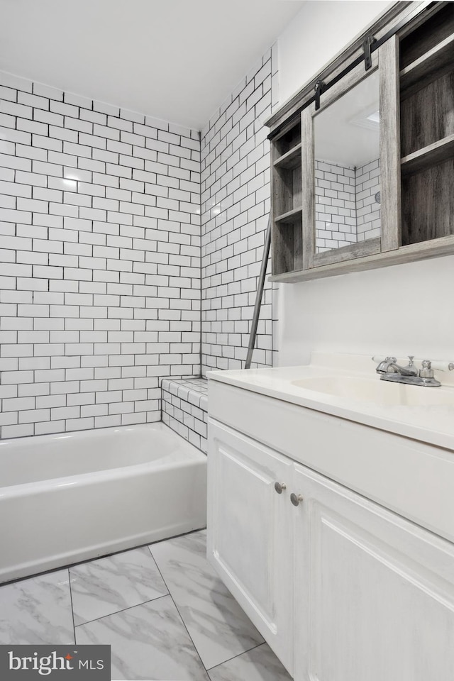 bathroom featuring tile floors, vanity, and bathing tub / shower combination