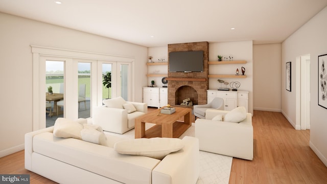 living room with brick wall, light hardwood / wood-style flooring, and a fireplace