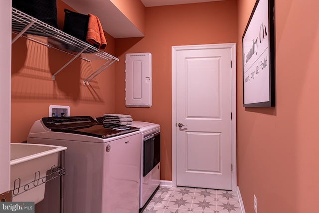 laundry area featuring hookup for a washing machine, light tile floors, and washing machine and clothes dryer