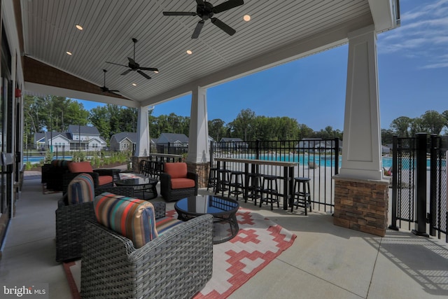 view of patio featuring an outdoor hangout area, ceiling fan, and a fenced in pool