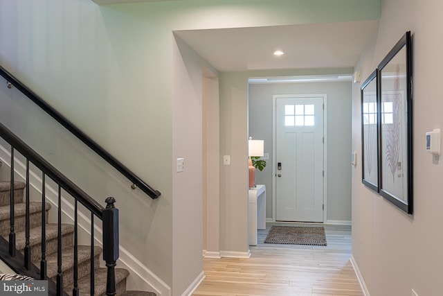 foyer entrance with light wood-type flooring