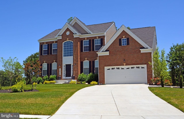 view of front of home featuring a front lawn and a garage