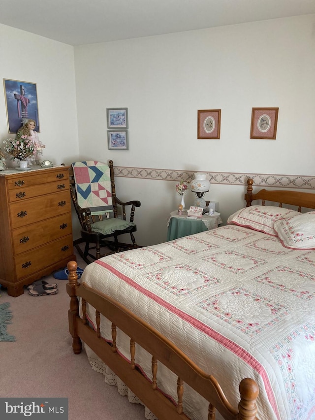 bedroom with light colored carpet