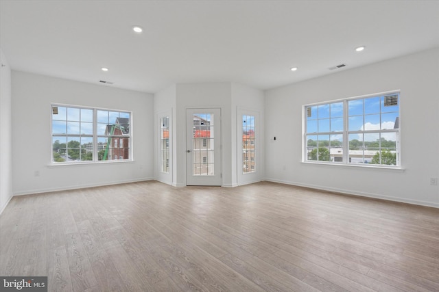 16423 River View Dr, Bristol, PA 19007 - unfurnished living room featuring plenty of natural light, wood finished floors, baseboards, and recessed lighting