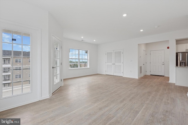 16423 River View Dr, Bristol, PA 19007 - unfurnished living room featuring light wood-style flooring, baseboards, and recessed lighting