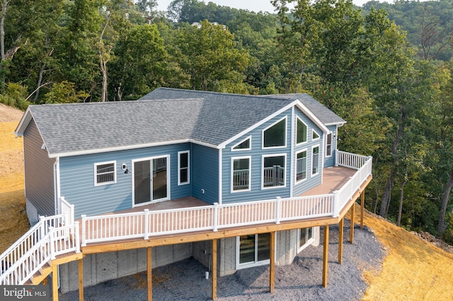 back of house featuring a deck