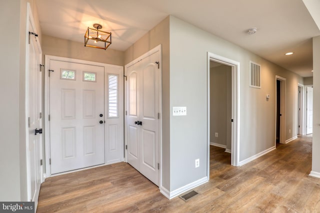 foyer entrance with light wood-type flooring