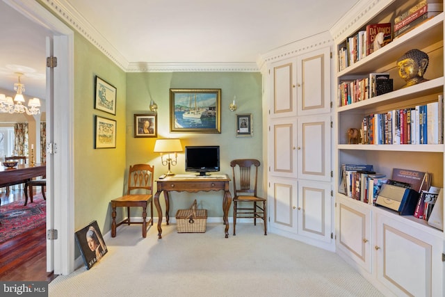 office space featuring ornamental molding, a chandelier, and light carpet