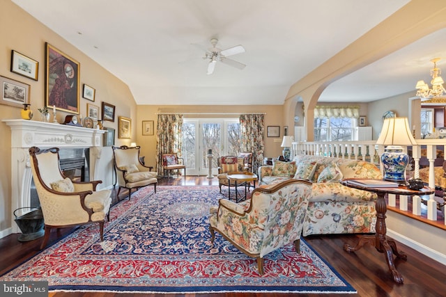 living room with a wealth of natural light and dark hardwood / wood-style floors