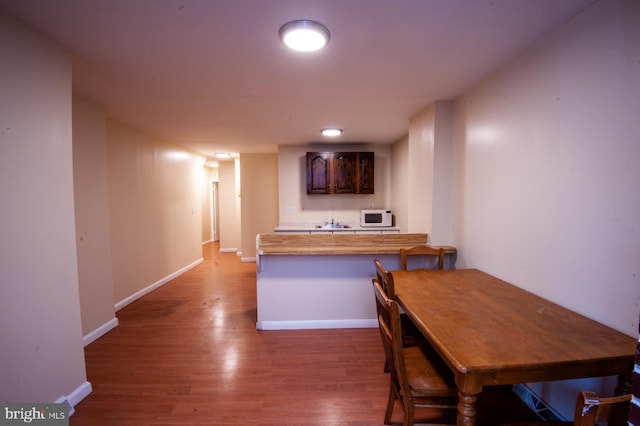 dining room featuring dark wood-type flooring