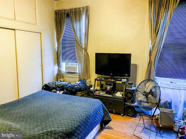 bedroom featuring a closet and light hardwood / wood-style flooring