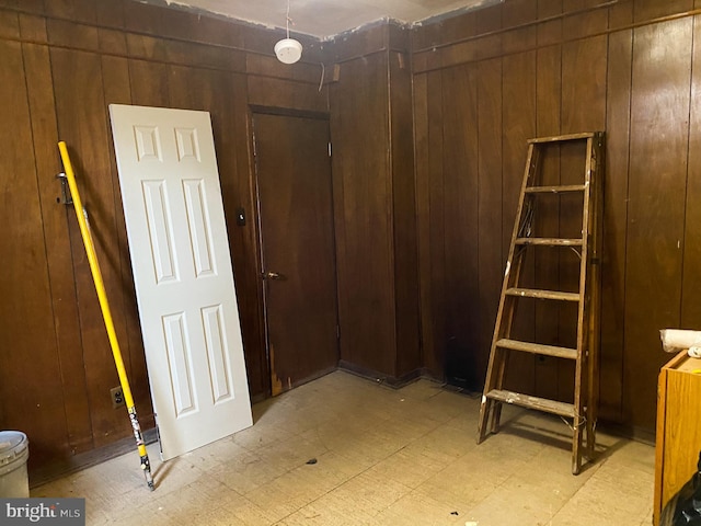 interior space featuring wood walls