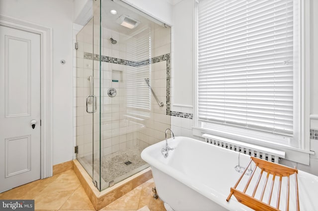 bathroom featuring independent shower and bath and tile patterned floors