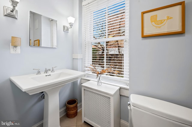 bathroom featuring tile patterned flooring and toilet