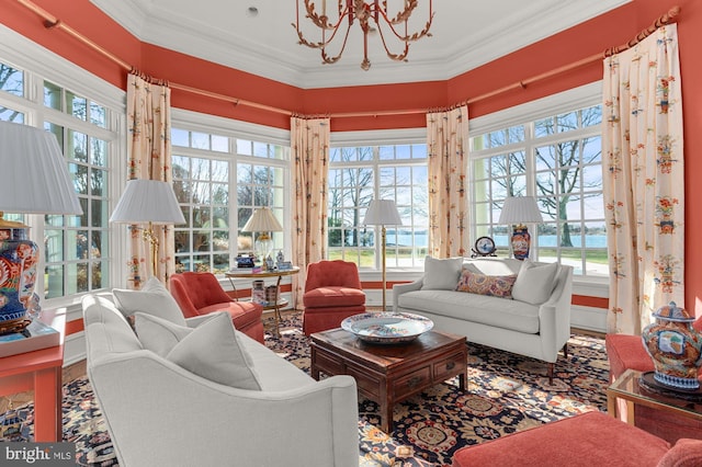 sunroom featuring a notable chandelier and a healthy amount of sunlight