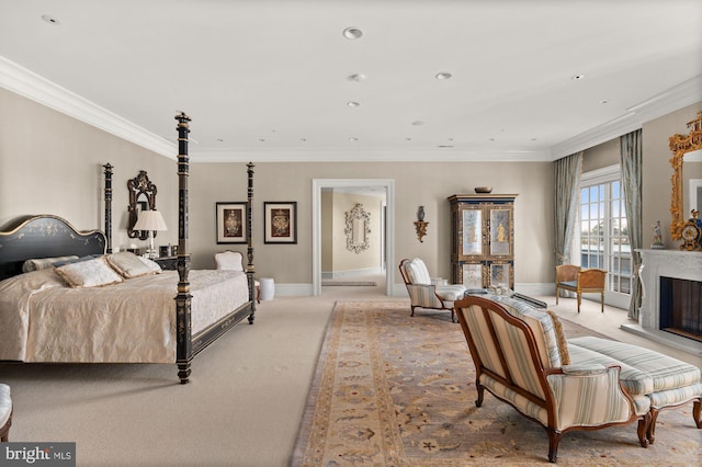 bedroom with crown molding and light carpet