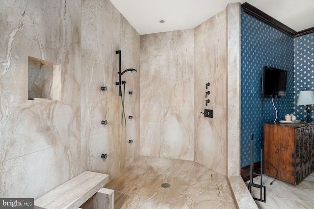 bathroom with tile walls, tiled shower, tile floors, and ornamental molding