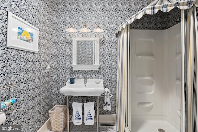 bathroom featuring walk in shower and tile flooring