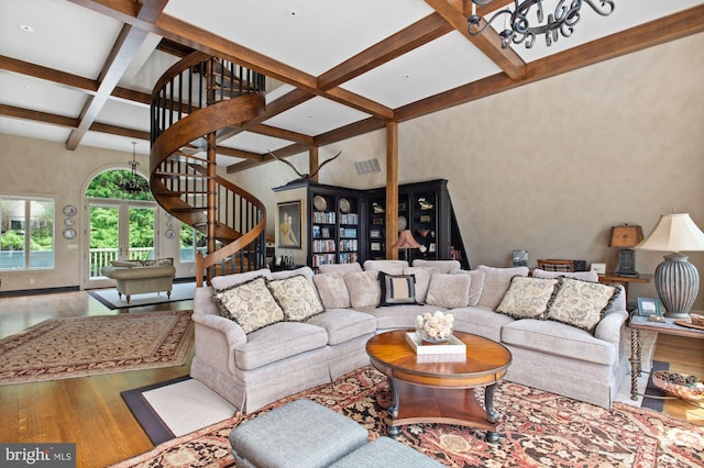 living room with coffered ceiling, hardwood / wood-style floors, and beamed ceiling