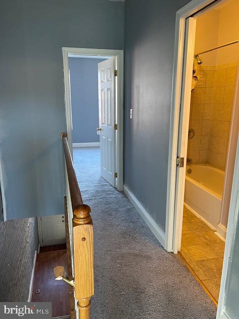 hall featuring tile flooring