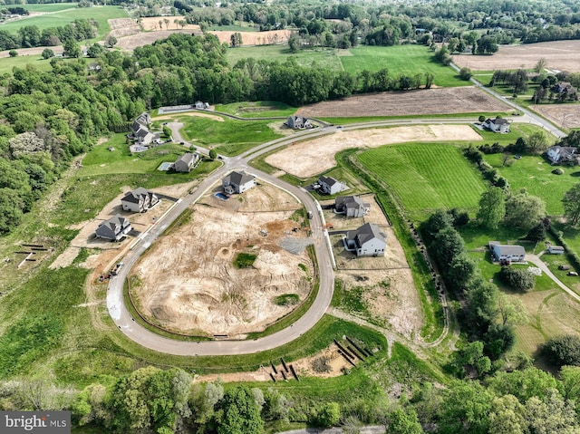 birds eye view of property with a rural view