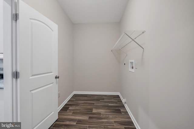 clothes washing area with hookup for a washing machine and dark hardwood / wood-style floors