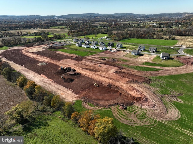 birds eye view of property featuring a rural view