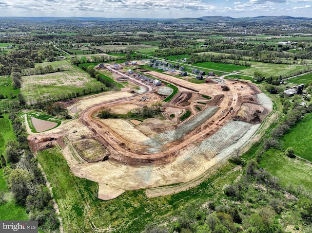 birds eye view of property featuring a mountain view