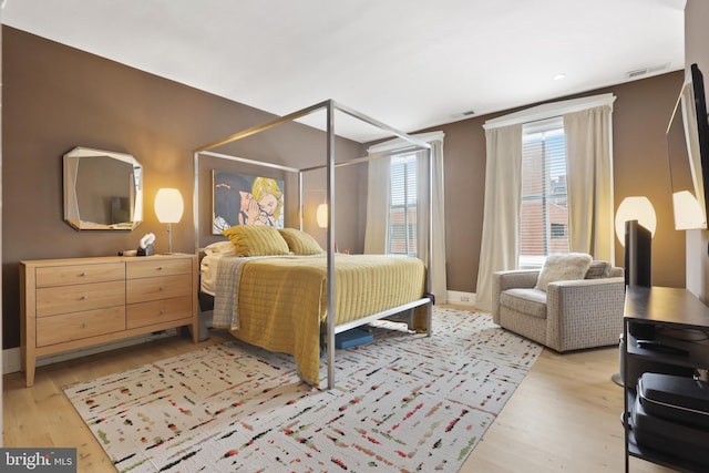 bedroom featuring light hardwood / wood-style floors