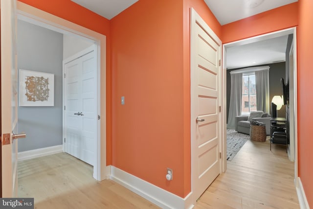 hallway with light wood-type flooring