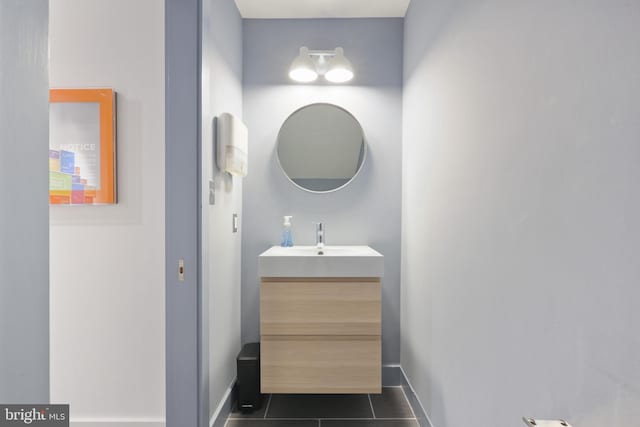 bathroom with tile flooring and vanity