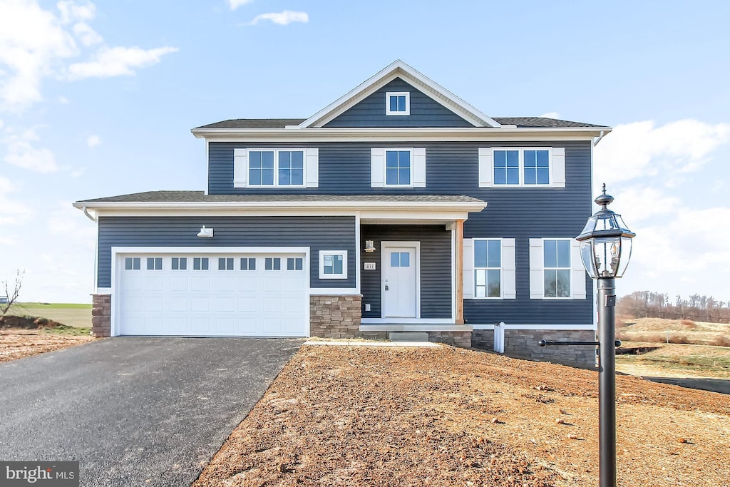 view of front of property featuring a garage