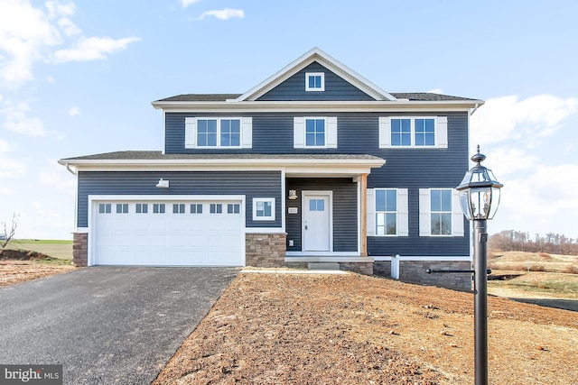 view of front of property featuring a garage