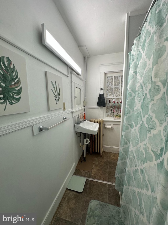 bathroom featuring tile floors and sink