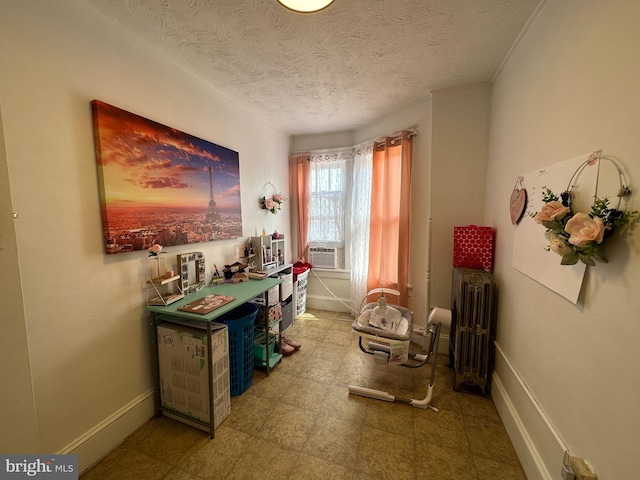 interior space featuring tile floors, a textured ceiling, and radiator heating unit