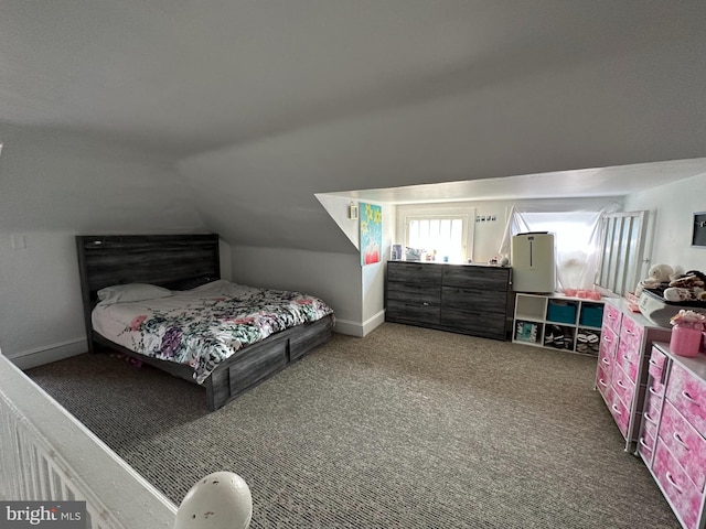 carpeted bedroom featuring lofted ceiling