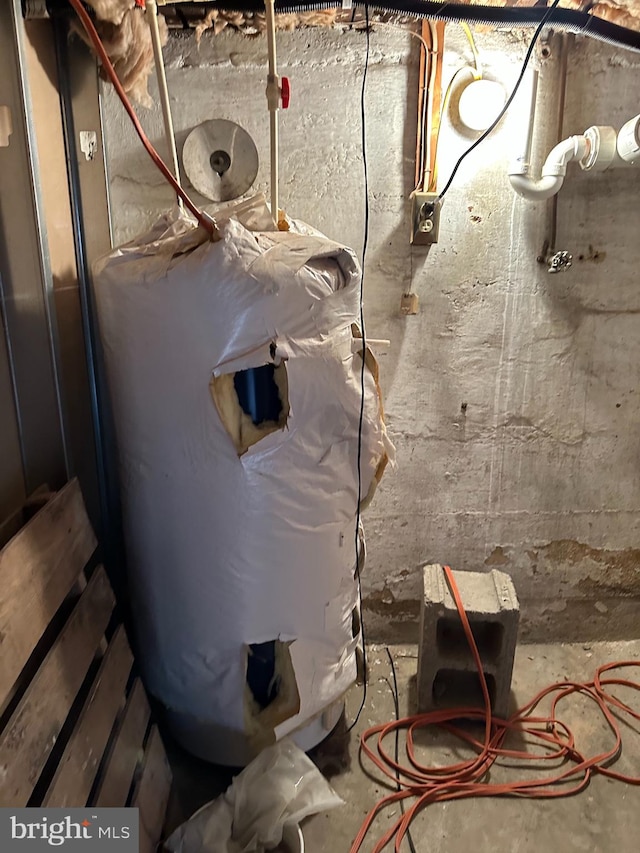 utility room featuring water heater