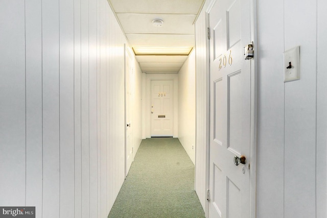 hall featuring light carpet