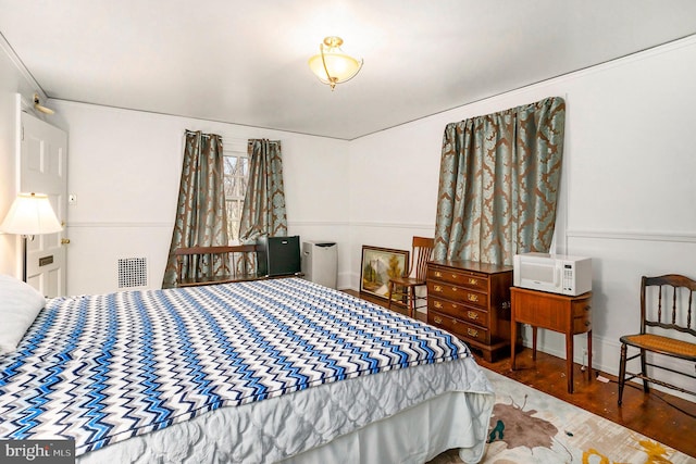 bedroom featuring dark wood-type flooring