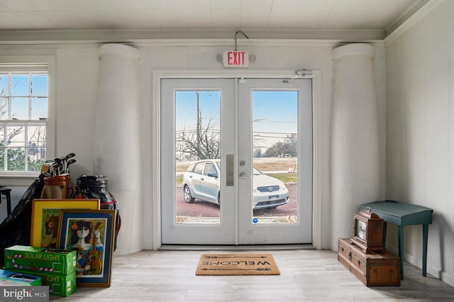 doorway featuring plenty of natural light, light hardwood / wood-style floors, and french doors