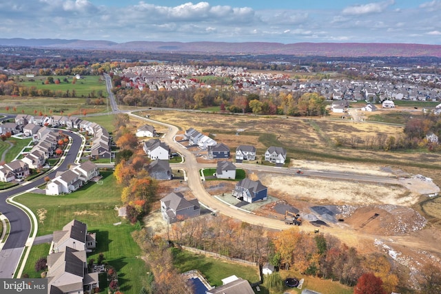 birds eye view of property featuring a mountain view