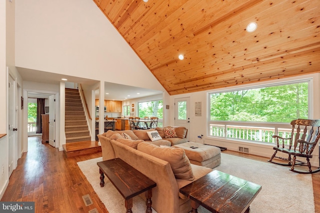 living room with high vaulted ceiling, wooden ceiling, and light hardwood / wood-style flooring