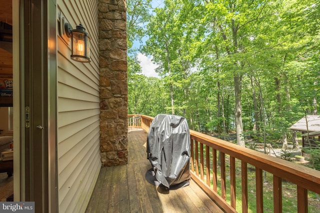 wooden deck featuring grilling area