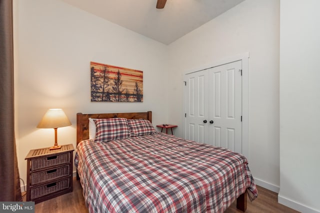 bedroom featuring a closet, ceiling fan, and dark hardwood / wood-style flooring