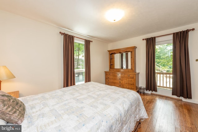 bedroom featuring dark hardwood / wood-style flooring