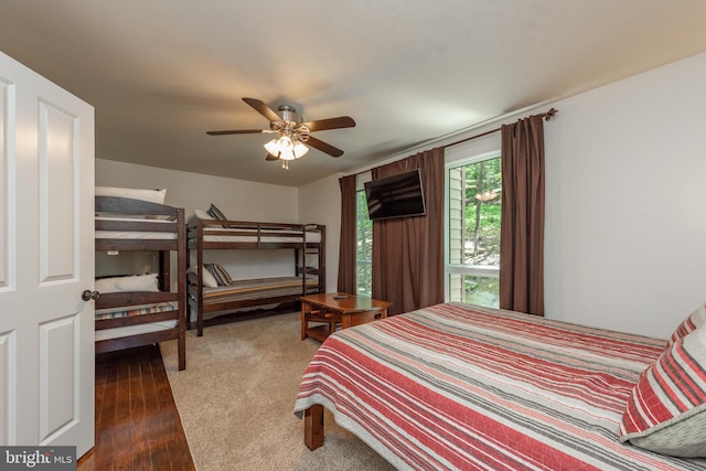 bedroom featuring ceiling fan and dark wood-type flooring