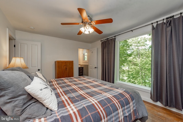 bedroom with ceiling fan and hardwood / wood-style floors