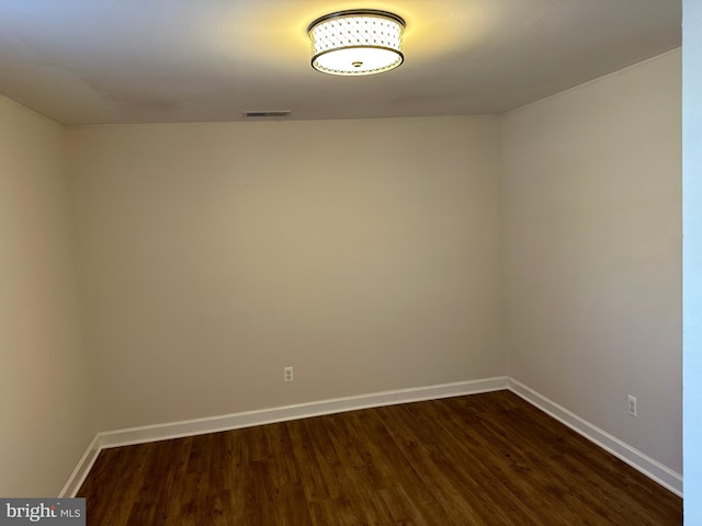 empty room featuring dark wood-type flooring