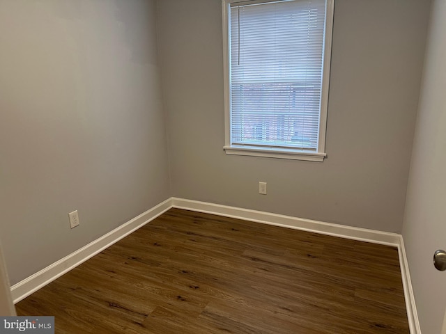 empty room featuring dark hardwood / wood-style floors