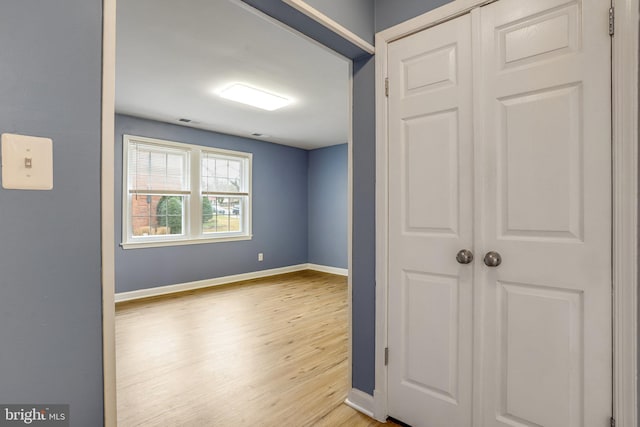 bonus room with light hardwood / wood-style flooring